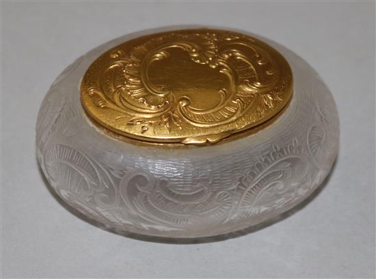 An early 20th century French 18ct gold mounted rock crystal oval snuff box, 2.25in.